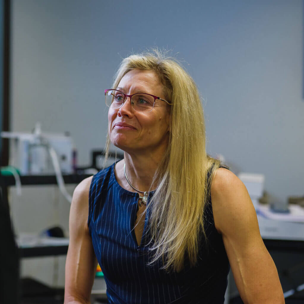 Dr. Bybee, a practitioner of functional medicine in Tucson, carefully listening to a patient during an appointment